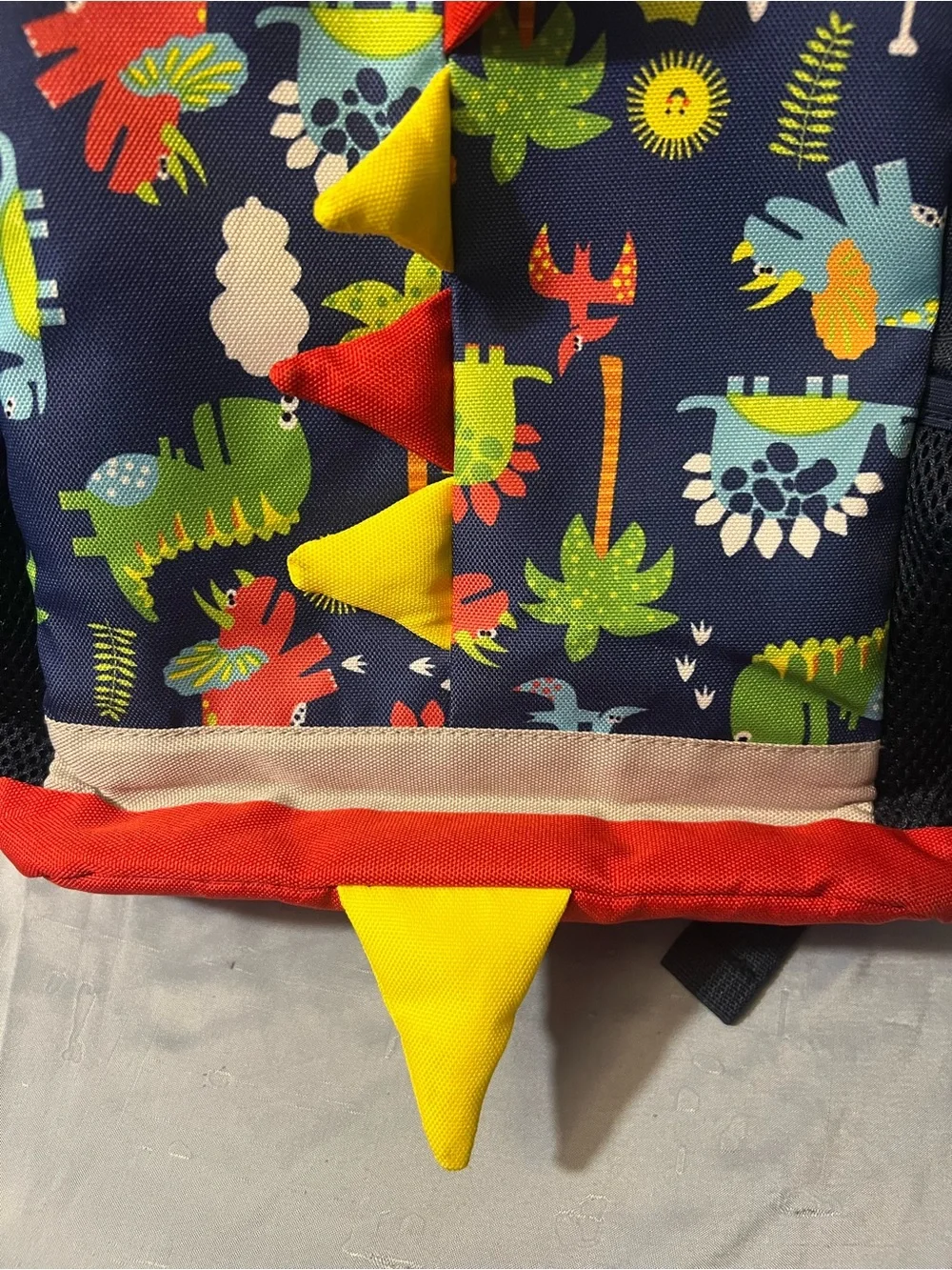 Kids Dinosaur Print Navy Backpack with Red & Yellow Accents